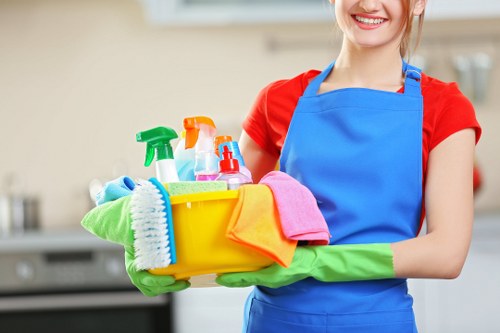 Cleaner preparing equipment safely before a carpet cleaning task